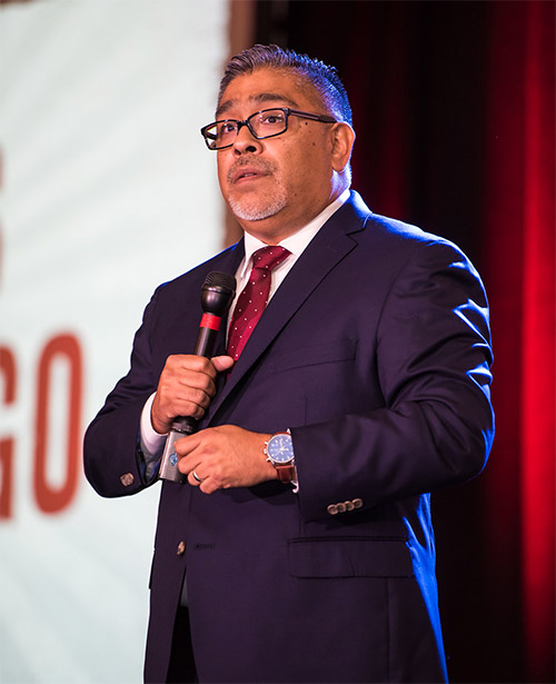 Carlos Samaniego, EA speaking at a tax resolution event